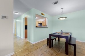The dining nook, next to the kitchen and adjacent to the living room, provides a central area for seamless gathering and entertaining.