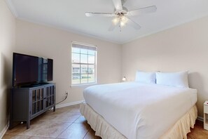 Guest Bedroom 2 is furnished with a comfy, plush king-size bed, a ceiling fan for added comfort, and a Smart TV for personalized entertainment.