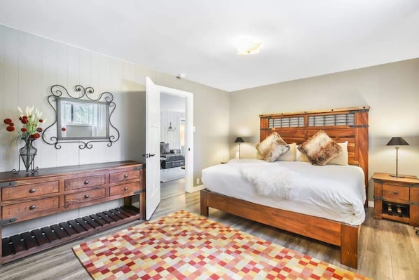 The stately master bedroom is a restful retreat that boasts a king-size bed, matching nightstands and lamps, a dresser, large, walk-in closet and an en suite bathroom.