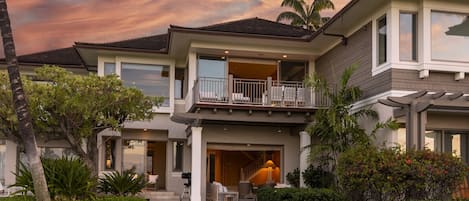 Back of this stunning villa showcasing the upper and lower lanais.