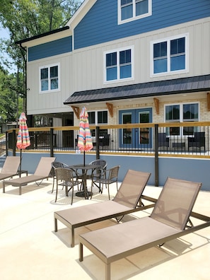 Lower patio with plenty seating for sunbathing.