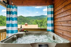Soak in the hot tub while enjoying the mountain views.