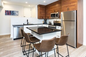 Modern Kitchen with Quartz countertop and island seating