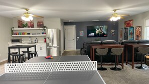 Game room: Ping pong with board game table and theater area