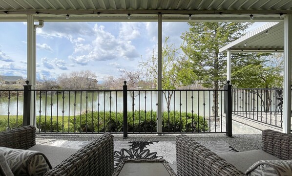 View of the lake from the outdoor sitting area with recliners