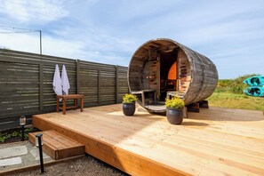 Cedar sauna, privacy fence, cold tap shower.