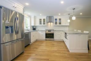 Bright and airy large kitchen with brand-new appliances.