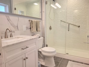 marble vanity, walk-in shower, heated floors ensuite in mother-in-law apartment