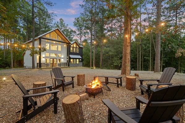 Welcome to Range Life - your modern luxury escape nestled in the pines of Broken Bow!