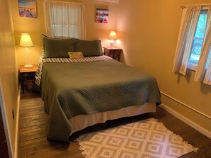 First bedroom with a queen bed. This bedroom is right off the kitchen.