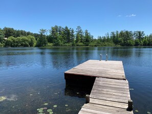 Large dock with room for a boat, swimming and lounging on the lake. 