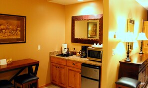 Wet bar / Kitchenette with mini fridge, microwave, coffee maker, toaster, sink +