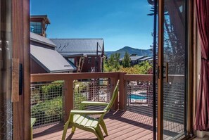 Enjoy an evening glass of wine on the private deck with views of the mountains.