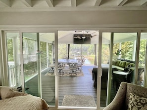 View out to the enclosed outdoor dining/sitting area.