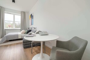 Large table with chairs for eating communal meals. 