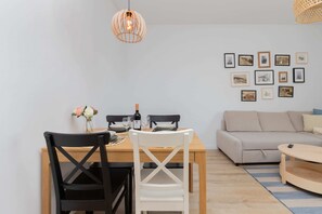 Dining table set for four, with decorative elements and a cozy ambiance.

