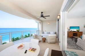 Walkout access from the living area to the furnished private balcony.