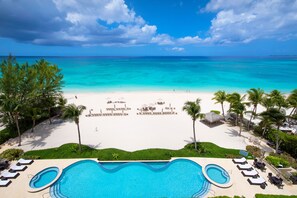 Complimentary beach chair and umbrella service is set up daily for resort guests. 