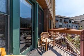 Private balcony with seating and ski slope views.