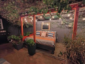 A daybed under the patio cover for relaxing and taking a nap or reading a book :)