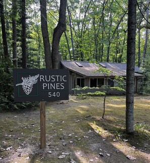 This cozy cottage in  a wooded area is close to boat launch on Little Long Lake.