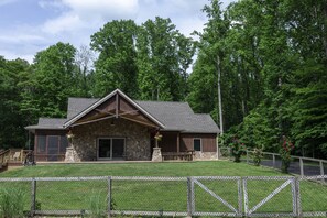 A front porch perfect for sitting, enjoying nature, and sharing a glass of wine!