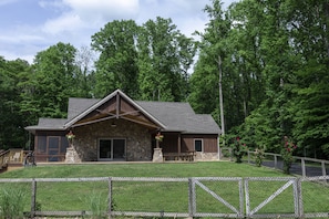 A front porch perfect for sitting, enjoying nature, and sharing a glass of wine!