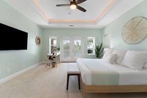HUGE master suite with king bed, 65" smart TV, desk, water view & porch access