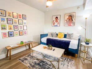 Enjoy a colorful and cozy living room that adds a lively touch to your stay.