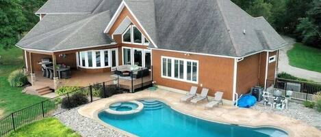 Aerial View of the house and pool area. Round sitting area in the pool is perfect for relaxing on hot days!