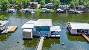 Huge modern dock with serving bar, swim platform, refrigerator, TV and stereo.