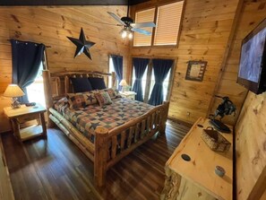 Main Level: Very comfy king log bed with London Fog sheets and doors to the deck