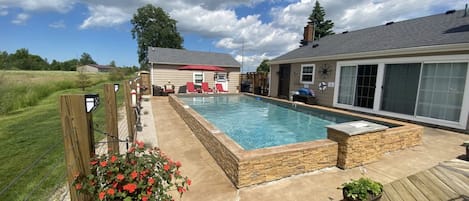 The Pool and "Dry Dock".  Your in ground pool, tanning area + Patio and Grill !