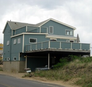 House from the street, big south deck. Park under the deck or in front of house.