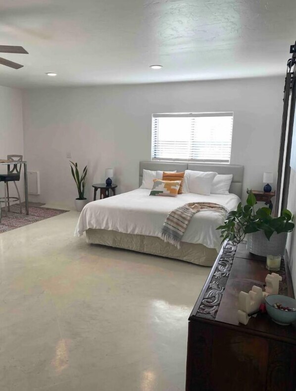 Very comfortable king Tempurpedic bed made up with nice sheets and pillows.