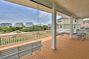 Step out onto the large outdoor deck and marvel at the lavish surroundings.