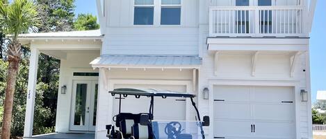 New home with a new lifted 6-seater golf cart. 2 car garage and driveway parking