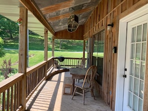 large wraparound porch with custom lighting