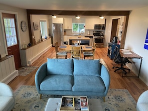 Full view of Living room, dining table and kitchen. 