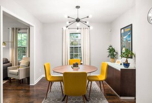 Chic dining experience: Stylish dining room with seating for 4, perfect for cozy meals and conversations.