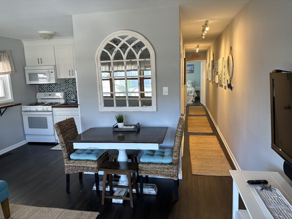 The open living, area. The long hallway offers privacy to bedrooms and bathroom.