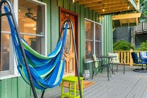 Plenty of relaxation time on Chimney Summit Chalet second-level porch. NEW: Rocking Chairs!