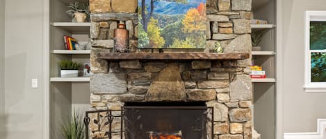 Each living room on levels 1 & 2 has a gorgeous stone fireplace includes an electric fire with flames, heat, or both. Level 2 Art: "Deciduous Forest in Autumn, Blue Ridge Parkway, North Carolina"