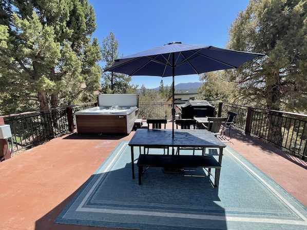 Hot Springs hot tub,Hampton Bay metal chairs w/pads, gas fire pit on the deck.