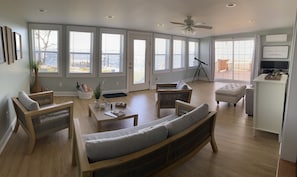 Sunroom facing the water with direct access to the deck and backyard 