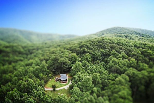 Aerial view of our cabin nestled in the mountains