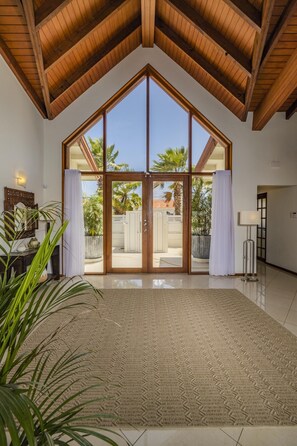 As you enter this property, you will be astounded with its floor-to-ceiling glass entrance door and wide and spacious entryway.