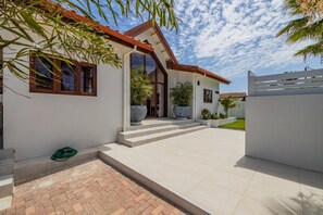 As you enter this property, you will be astounded with its floor-to-ceiling glass entrance door and wide and spacious entryway.