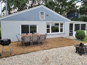 Back deck area with a bay view