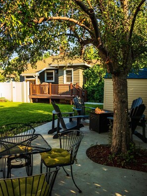 Relax in the private, shaded backyard after a long day exploring Cody Country!